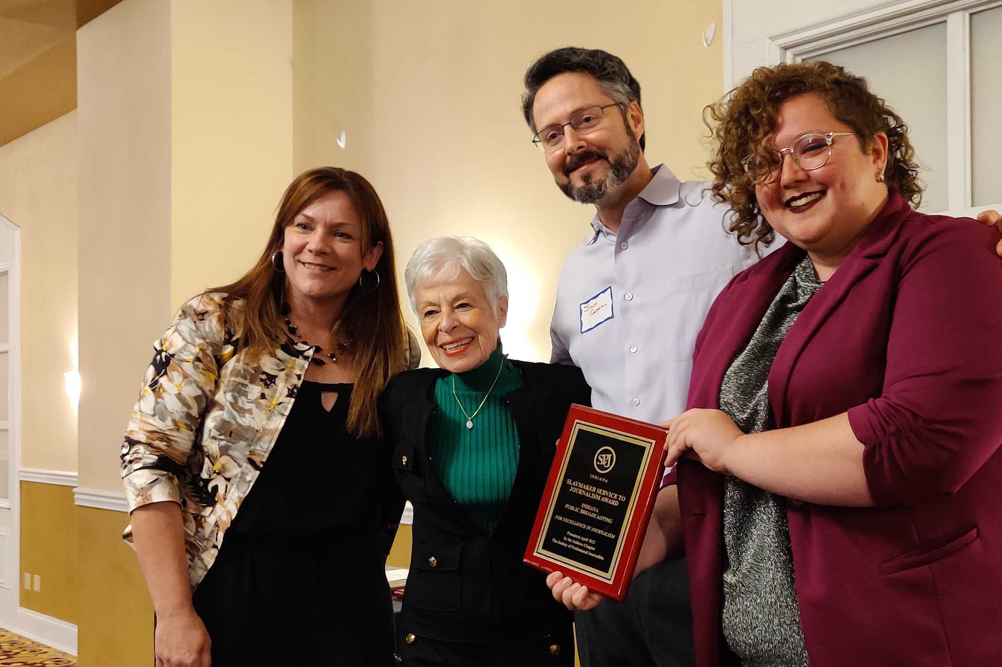 From left to right: Lisa Renze-Rhodes, Julie Slaymaker (who the award is named after), Scott Cameron (IPB News mananging editor) and Lauren Chapman. Lauren holds the Slaymaker award as all four pose for a photo.